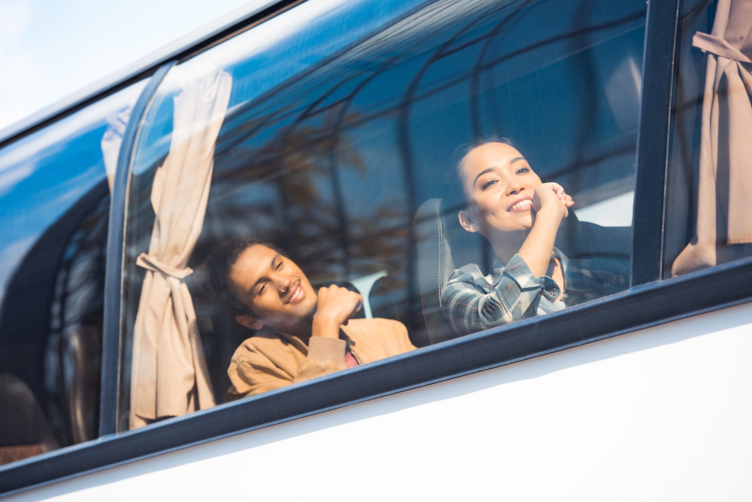 Happy Asian and Mixed-Race Tourists on Birmingham Midi Coach Trip